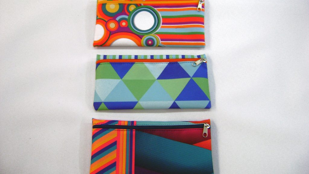 Cartucheras confeccionadas en tela cordura planas con impresión.